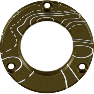 Circular brown metal flange with three mounting holes and white chalk-like guide lines drawn on its surface.