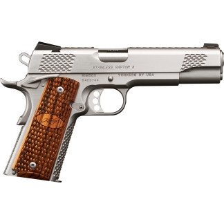 Side view of a stainless Kimber semi-automatic pistol with checkered wooden grip and engraved markings on the slide (Stainless Raptor II, Yonkers NY USA).