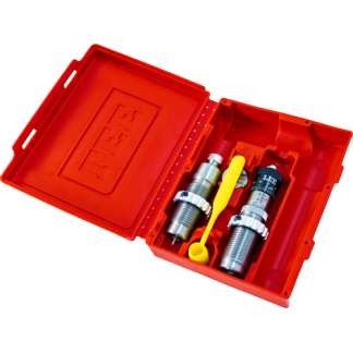 Red plastic toolbox open to reveal two metal sockets with yellow lever and a small wrench-like tool.
