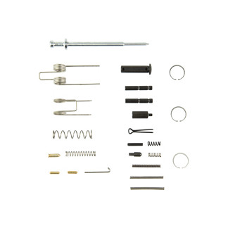 Assorted syringe parts laid out in rows: needles, plungers, barrels, seals, springs, and small connectors.