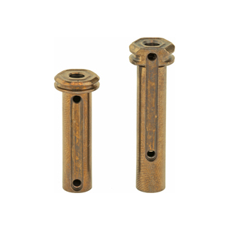 Two rusted cylindrical metal sleeves with circular flanges on top, each featuring a vertical slot and a hole along the length.