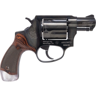 Side view of a black revolver with a wood-grain grip and silver cylinder.