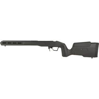 Black tactical shotgun with an adjustable shoulder stock and pistol grip, shown in profile.