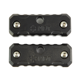 Two black rectangular metal blocks with knurled edges and screws at each end, arranged one above the other. Center shows a circular feature and logo.
