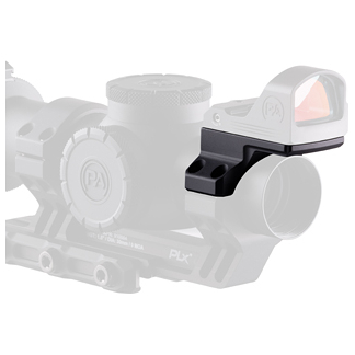 Close-up of a compact red dot sight mounted on a rail system, shown at an angle on a gun accessory.