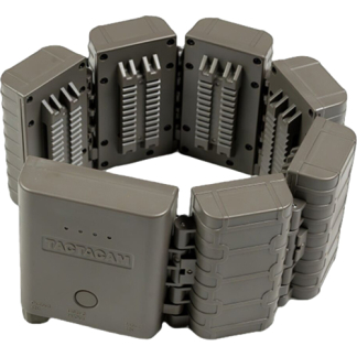 Gray modular battery pack arranged in a circular ring, consisting of interlocking blocks with exposed contact-like components in the center modules.