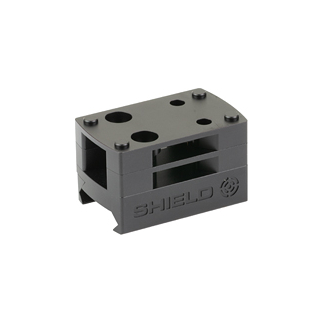 Gray plastic terminal/shield block with multiple top holes and side openings, branded SHIELD.