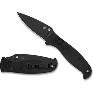 Two black folding knives, one opened with blade extended and one closed beside it on a white background