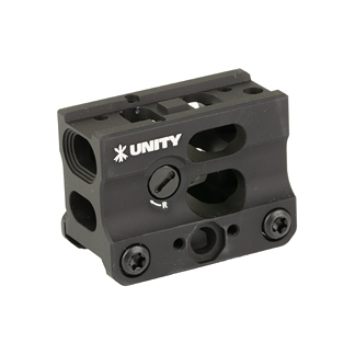 Close-up of a black Unity bicycle clamp with mounting holes and an adjustment dial, used to secure components on a handlebar assembly.