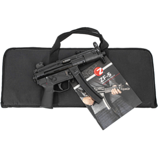 Black compact submachine gun with magazine resting on a padded zippered gun case, with a nearby user-manual booklet.