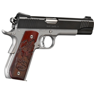 Close-up side view of a silver and black semi-automatic pistol with a carved wooden grip and engraved detail on the grip panel.