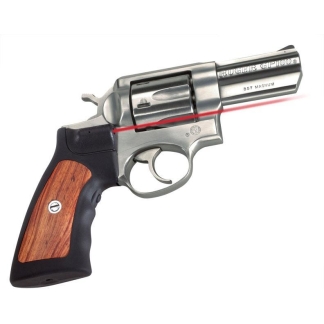 Silver revolver with a wooden grip and a red laser line aimed along the barrel to the right area of the image.