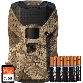 Camouflaged trail camera with hex-pattern front, accompanied by eight Duracell AA batteries and an SD memory card.