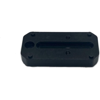 Black plastic camera mounting plate with a long central slot and four small feet, used as a quick-release plate
