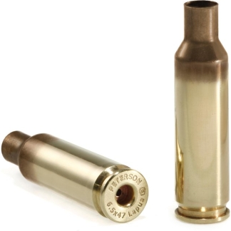 Two brass cartridge casings on a white background, one standing upright and the other lying on its side showing the base with stamped text