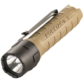 Tan tactical flashlight with a textured grip, black front, and a metal pocket clip.