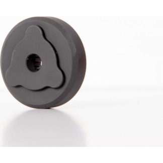 Gray circular disk with a cloud-shaped inner cutout and a central hole, resting on a white surface.