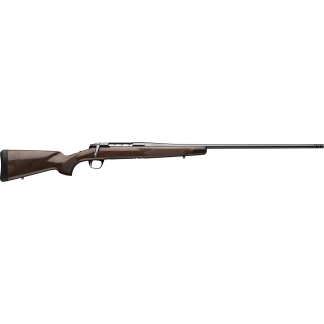 Bolt-action hunting rifle with a polished wooden stock and long steel barrel viewed from the side.