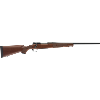 Bolt-action rifle with wooden stock and long metal barrel, shown in profile from side.