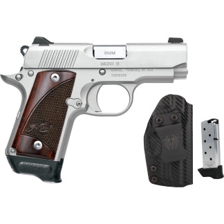 Silver semi-automatic handgun with wood grip, shown with a black holster and a magazine accessory.