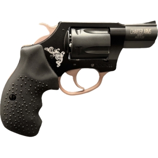 Close-up of a black revolver with a decorative white scroll engraving and brown grip sawed-off at the trigger area
