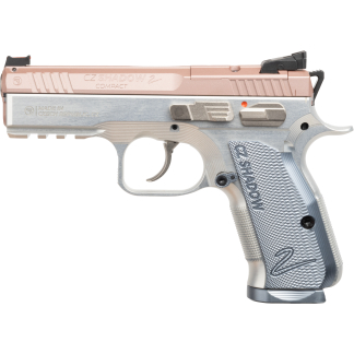 Side view of a two-tone CZ Shadow 2 Compact semi-automatic pistol with a pink slide and silver frame against a black background, shown in profile.