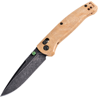Close-up of a knife with a dark blade and a light wood-grain handle secured by black screws, diagonal orientation
