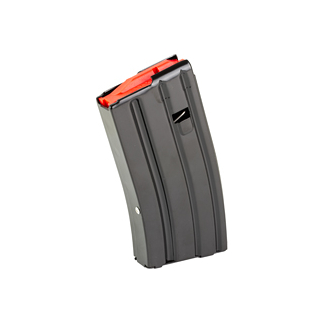 Black curved firearm magazine with an orange follower showing at the top, standing upright.