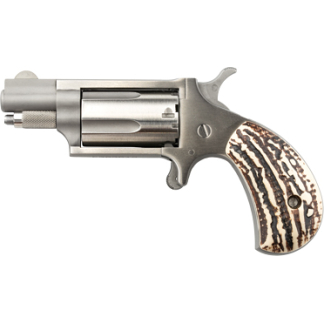 Side view of a silver revolver with a carved antler-style grip.