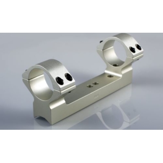 Double silver scope rings mounted on a base rail, a rifle scope mounting bracket.