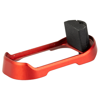 Red plastic handheld tool with a black rectangular block on top, likely a small jig or cutter accessory.
