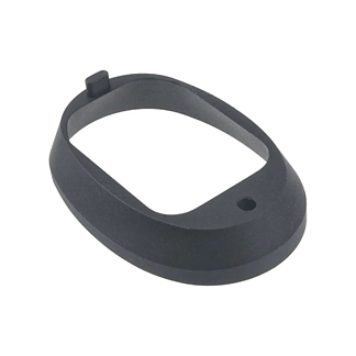 Dark gray plastic wrist strap or band component with a raised tab and a circular hole, likely part of a wearable device.