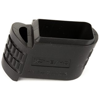 Black plastic firearm accessory with a rectangular hollow opening and ribbed grip on the side, likely a rifle mount or attachment.