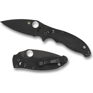 Black folding knife with a textured handle, blade partially extended, shown beside its closed position.