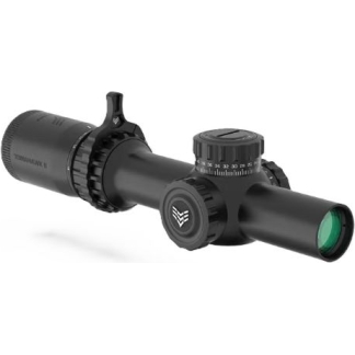 Close-up of a tactical riflescope with elevation/windage adjustment dials and lens caps, used for precision aiming.