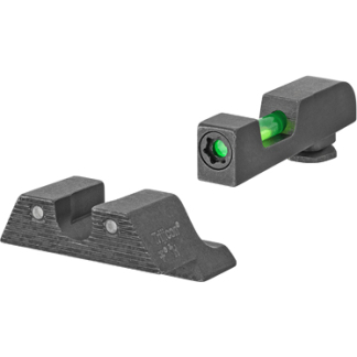 Two black handgun sights (detached): front sight with green fiber-optic insert and rear sight.