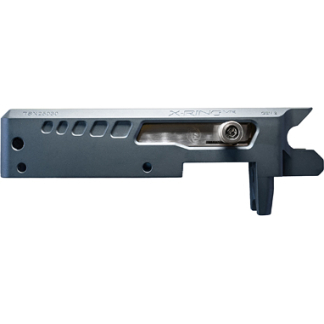 Close-up of a blue-gray metal machine part with a sliding silver bar and a round hole; 'X-RING' text visible.