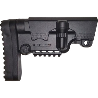 Side view of a black tactical rifle buttstock with adjustable cheek rest and knob, showing the mounting and slot rails on a modular stock piece.,