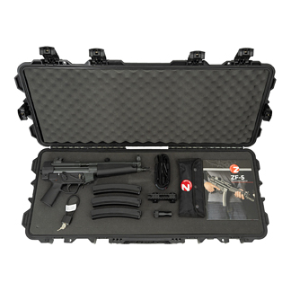 Open rugged hard case containing a handgun, two magazines, a holster, a small flashlight, and a user manual.