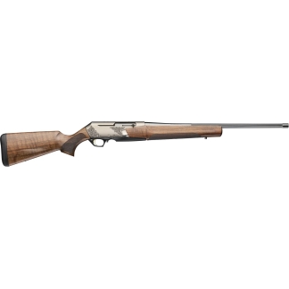 Side view of a polished wooden-stock shotgun with ornate engravings on the receiver and a long barrel, shown from the left