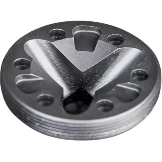 Round metal disc with a prominent X-shaped centerpiece and several small holes around the edge.