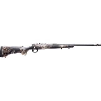 Camouflage-pattern bolt-action hunting rifle photographed from the left side, long barrel with a muzzle brake.