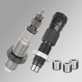 Two knurled metal precision connectors with threaded barrels and rings, plus four small spacers on a gray background.