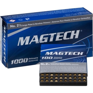 Magtech 1000 primers box with a small blue booklet and a tray of brass primers in front of a larger blue box behind it as packaging for ammunition components.