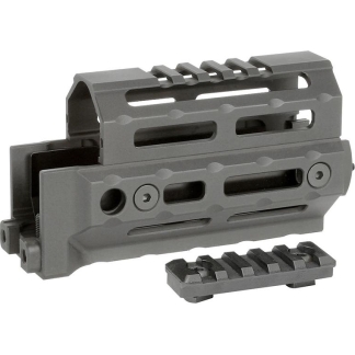 Gray modular rail system (Picatinny/rail segments) with a top rail and side slots; a small detachable rail piece sits nearby.
