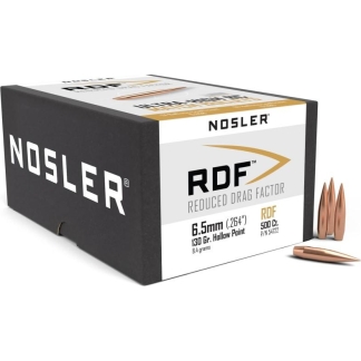 Nosler RDF ammunition box with white label and copper bullets placed beside it on a white background.