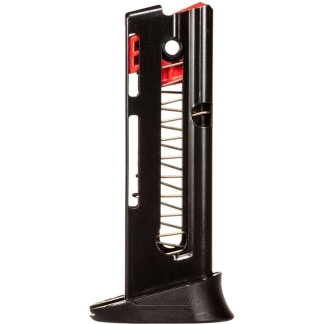 Detachable black firearm magazine with visible metal spring and red follower inside.