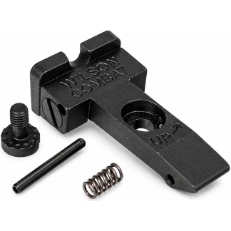 Wilson Combat lever with accompanying spring, pin, and screw—firearm accessory components on a white background.