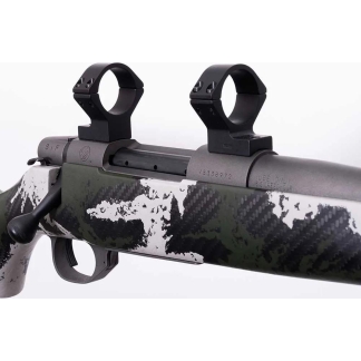 Rifle with two scope rings mounted on a camouflaged barrel, shown from the side.
