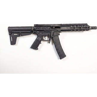 Black AR-style rifle with collapsible stock, long handguard, and curved magazine on a white background.